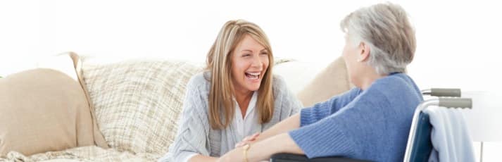Senior and caregiver having fun at a short term stay