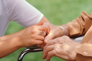 holding seniors' hand