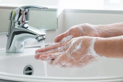 washing hands under running water