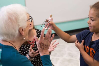 Senior plays with preschooler