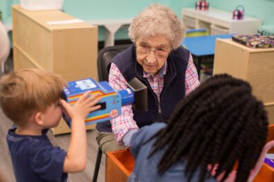 Senior interacting with Preschooler