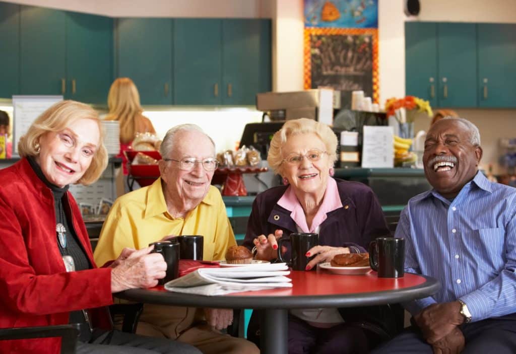 Seniors Enjoying Coffee and Laughing