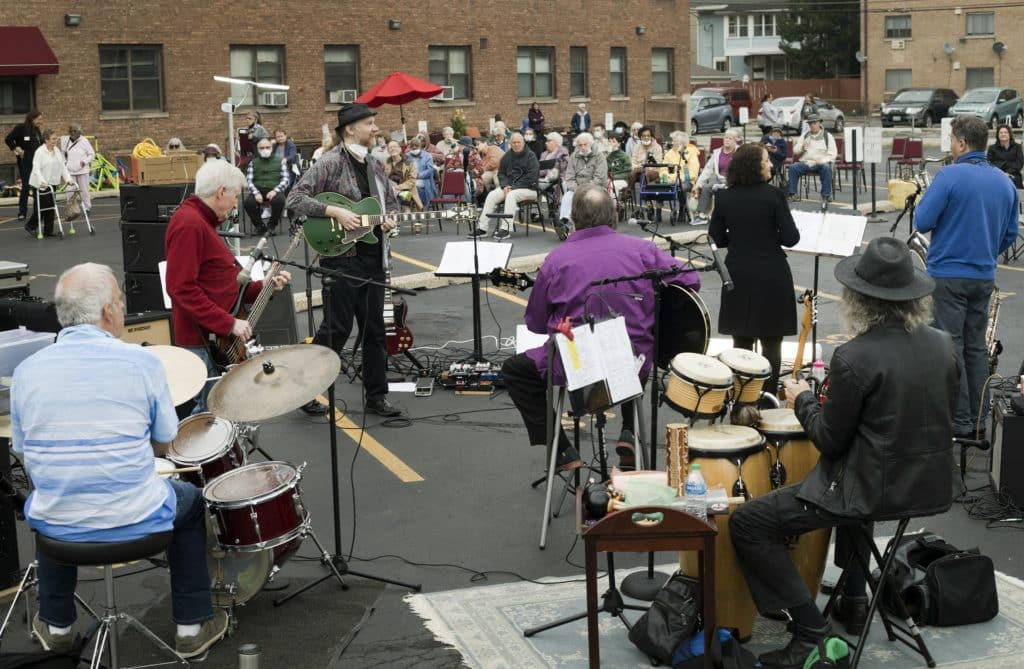 The Caught Off Guards at a free outdoor concert at Oak Park Arms Senior Living, September 23, 2022, in Oak Park, Ill.