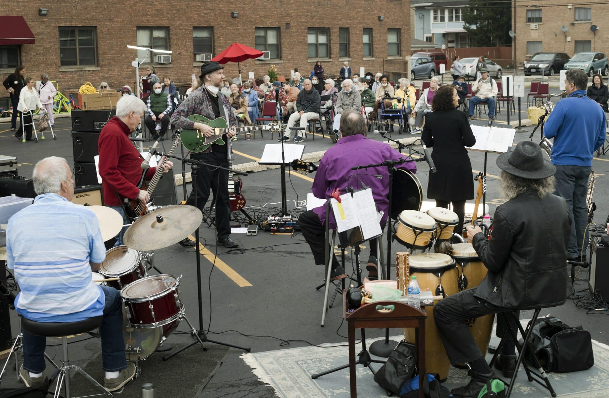 The Caught Off Guards at a free outdoor concert at Oak Park Arms Senior Living