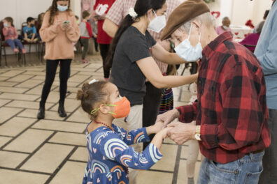 Oak Park Arms resident Donald Vivas dances with Kindness Creators Kayla B. during the Arms Valentines Day Dance Tuesday, February 14, 2023, in Oak Park, Ill.