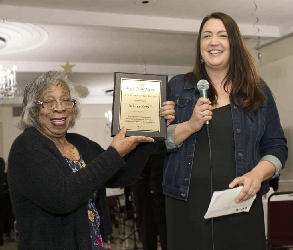 Oak Park Arms Delores Newell receives the Volunteer of the Decade from Renee Steingard Director of Leasing and Resident Engagement during Oak Park Arms Senior Living Spring Dance with the Falconaires. Saturday, April 22, 2023, in Oak Park, Ill.