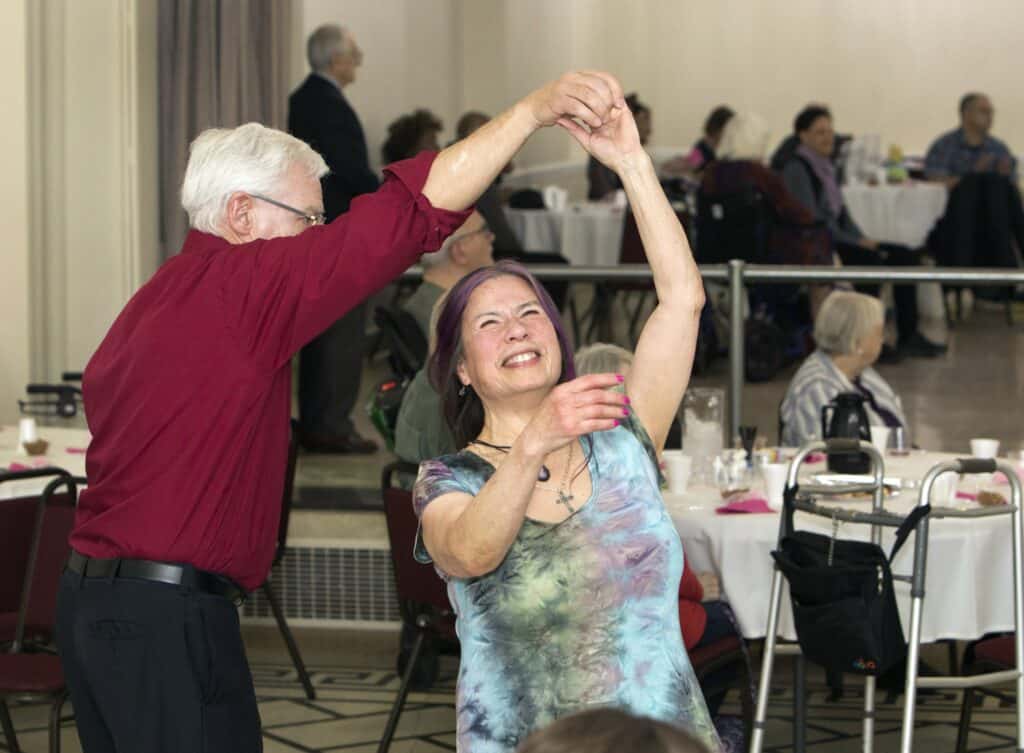 Area residents John Snyder and Nori Campa dance during Oak Park Arms Senior Living Spring Dance with the Falconaires. Saturday, April 22, 2023, in Oak Park, Ill.