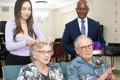 Dominga Coronado, Oak Park Arms leasing coordinator, places the crown on Marge Schwarz, as Moses Williams, Executive Director, and Prom King Don Sundstrom look on during Oak Parks Arms’ 41st annual Seniors’ Senior Prom held Friday, June 16, 2023, in Oak Park.