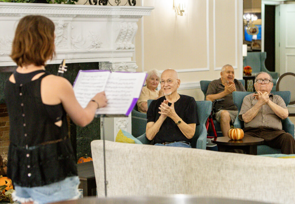 Lizzy Bell on the clarinet from Harmony for Hearts at the Oak Park Arms